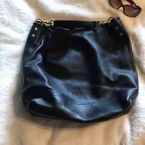 Black calfskin Mulberry bucket bag with braided shoulderstrap brass detailing.